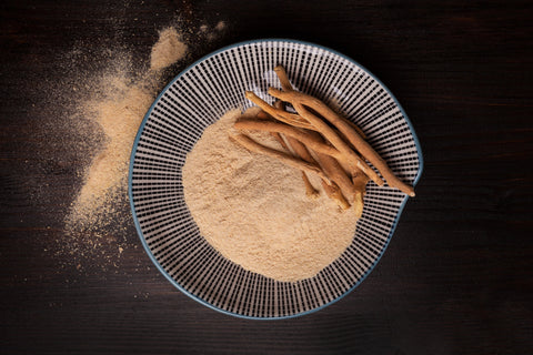 ashwagandha powder and root on a plate